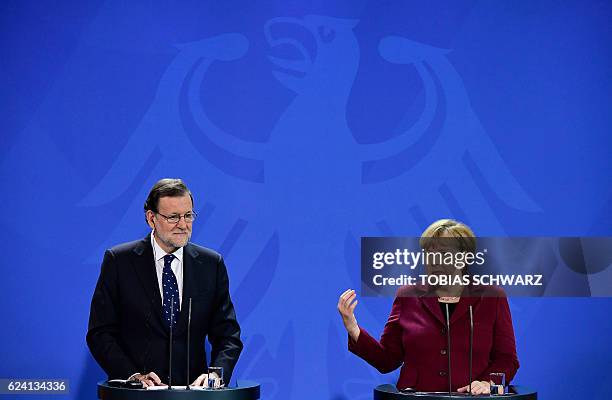 German Chancellor Angela Merkel and Spanish Prime minister Mariano Rajoy attend a press conference after teh meeting between the US President and...