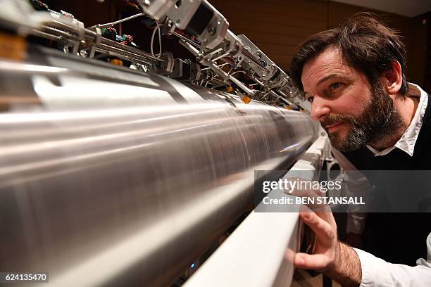 British composer and sound artist Nick Ryan poses with a cylindrical phonograph as part of his digital art project around space debris entitled...