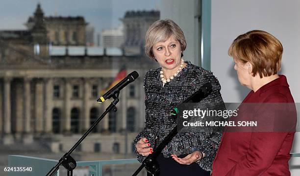 German Chancellor Angela Merkel and British Prime minister Theresa May attend a press conference prior to a bilateral meeting and after the meeting...