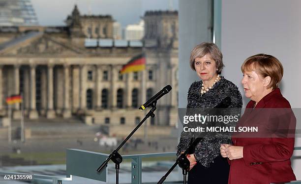 German Chancellor Angela Merkel and British Prime minister Theresa May attend a press conference prior to a bilateral meeting and after the meeting...