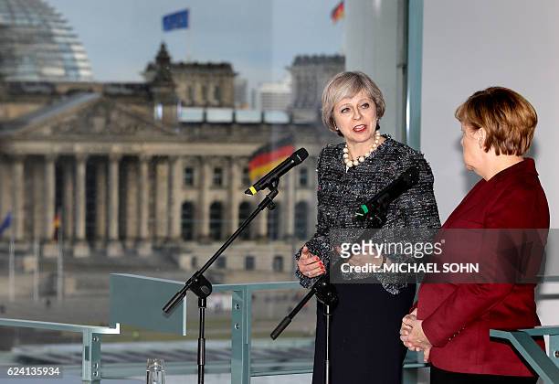 German Chancellor Angela Merkel and British Prime minister Theresa May attend a press conference prior to a bilateral meeting and after the meeting...