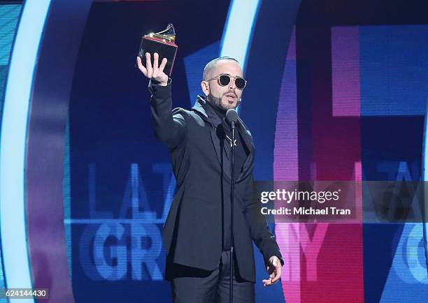 Yandel accepts Best Urban Fusion/Performance for 'Encantadora' onstage during the 17th Annual Latin Grammy Awards held at T-Mobile Arena on November...