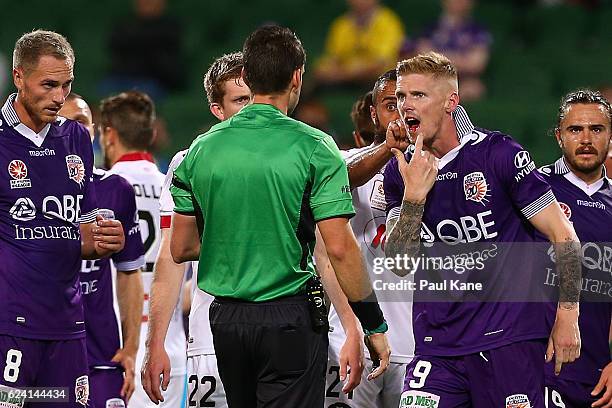 Andy Keogh of the Glory points to his bleeding mouth while addressing Referee Jarred Gillett, after receiving an elbow from Iacopo La Rocca of...