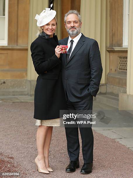 Sam Mendes with Alison Balsom after she received her OBE from the Prince of Wales during an Investiture ceremony at Buckingham Palace on November 18,...