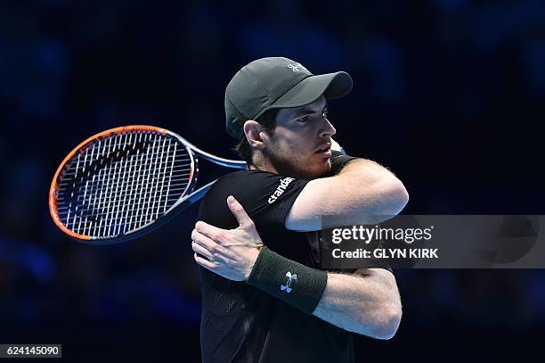 Britain's Andy Murray reacts after a point against Switzerland's Stan Wawrinka during their round robin stage men's singles match on day six of the...