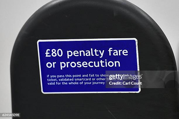 Fare evasion notice is displayed on a ticket barrier at Tottenham Court Road underground station on November 18, 2016 in London, England. London...