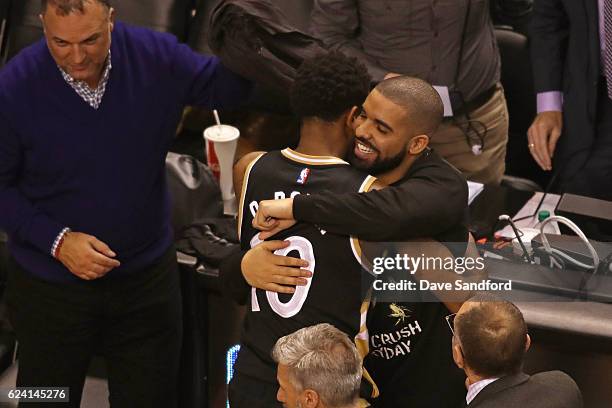Toronto Raptors Ambassador and Performer Drake hugs DeMar DeRozan of the Toronto Raptors after the game against the Golden State Warriors at Air...