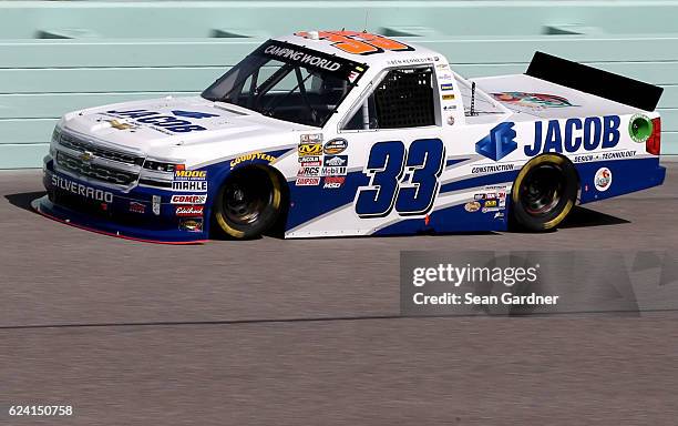 Ben Kennedy, driver of the Jacob Chevrolet, practices for the NASCAR Camping World Truck Series Ford EcoBoost 200 at Homestead-Miami Speedway on...