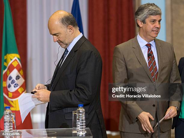 European Commissioner for Economic and Financial Affairs, Taxation and Customs Pierre Moscovici and Portugal's Minister of Finance Mario Centeno hold...