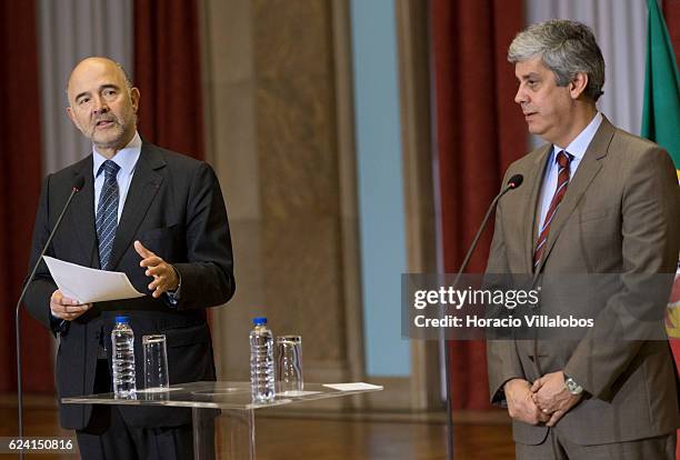 European Commissioner for Economic and Financial Affairs, Taxation and Customs Pierre Moscovici and Portugal's Minister of Finance Mario Centeno hold...