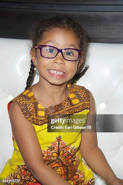 Daughter of Manuela Testolini and Eric Benet Lucia Bella Benet poses for a photo at the 'In A Perfect World Give 100 Fundraiser' at The District...