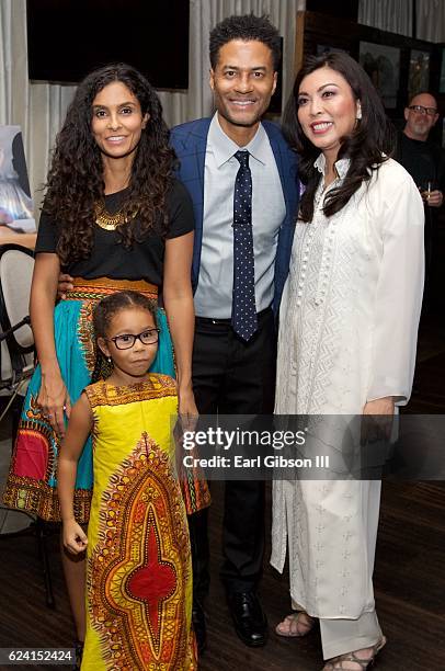 Manuela Testolini, Eric Benet, guest and Lucia Bella Benet attend the 'In A Perfect World Give 100 Fundraiser' at The District Restaurant on November...