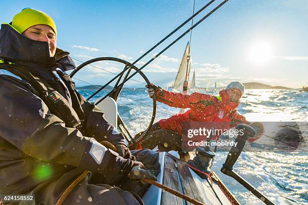 sailing crew on sailboat on regatta - zeil stockfoto's en -beelden