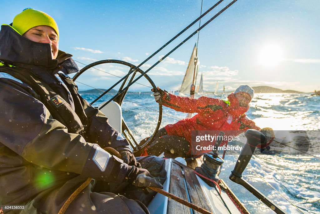 Sailing crew on sailboat on regatta