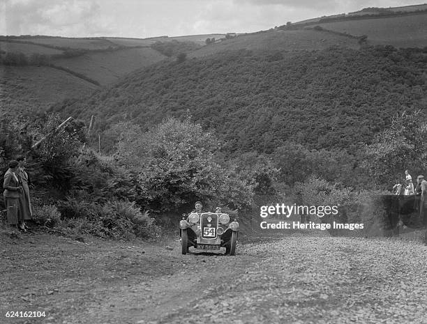 Singer 2-seater competing in the Mid Surrey AC Barnstaple Trial, Beggars Roost, Devon, 1934. Artist: Bill Brunell.Singer 1933 972 cc. Vehicle Reg....