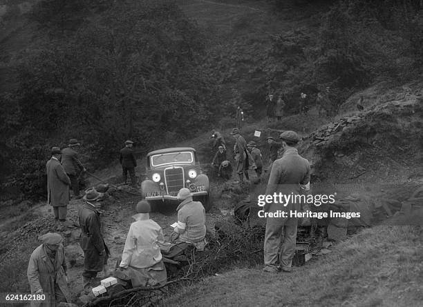 Ford V8 drop head coupe of GM Denton competing in the MCC Sporting Trial, 1935. Artist: Bill Brunell.Ford V8 Drop head coupe. 1935 3622 cc. Vehicle...