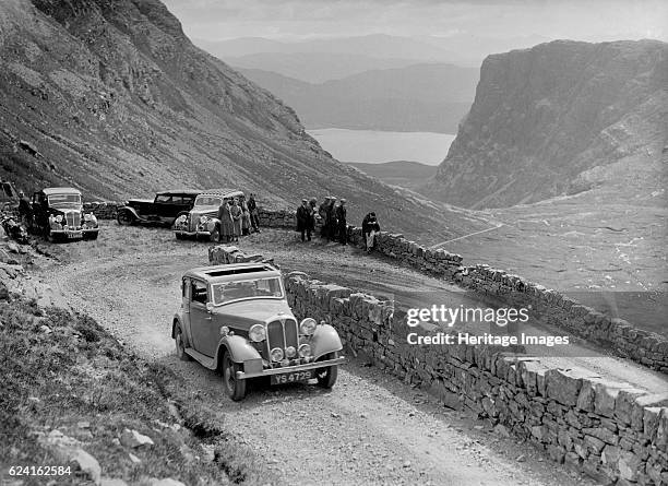 Rover 4-door saloon of IH Mackay competing in the RSAC Scottish Rally, 1936. Artist: Bill Brunell.Rover 4-door saloon. 1935 Vehicle Reg. No. YS4729....