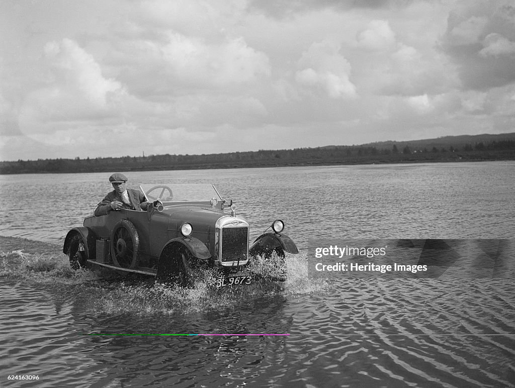 HG Pope driving a GWK through water at a demonstration event, Frensham Common Pond, Surrey, 1922