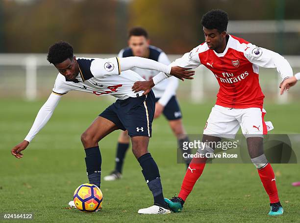 Shayon Harrison of Tottenham Hotspur is challenged by Gedion Zelalem of Arsenal during the Premier League 2 match between Tottenham Hotspur and...