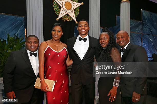 Russell Westbrook of the Oklahoma City Thunder poses for a photo with his family, Ray Westbrook, Nina Ann-Marie Westbrook, Shannon Westbrook and...