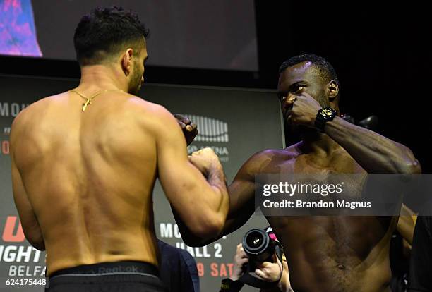 Gegard Mousasi of the Netherlands and Uriah Hall of the United States face off during the UFC Fight Night weigh-in at the SSE Arena on November 18,...