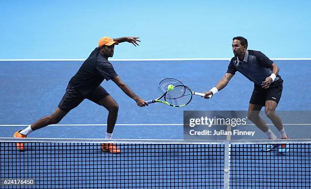 Rajeev Ram of the United States and partner Raven Klaasen of South Africa return the ball during the men's doubles match against Feliciano Lopez of...