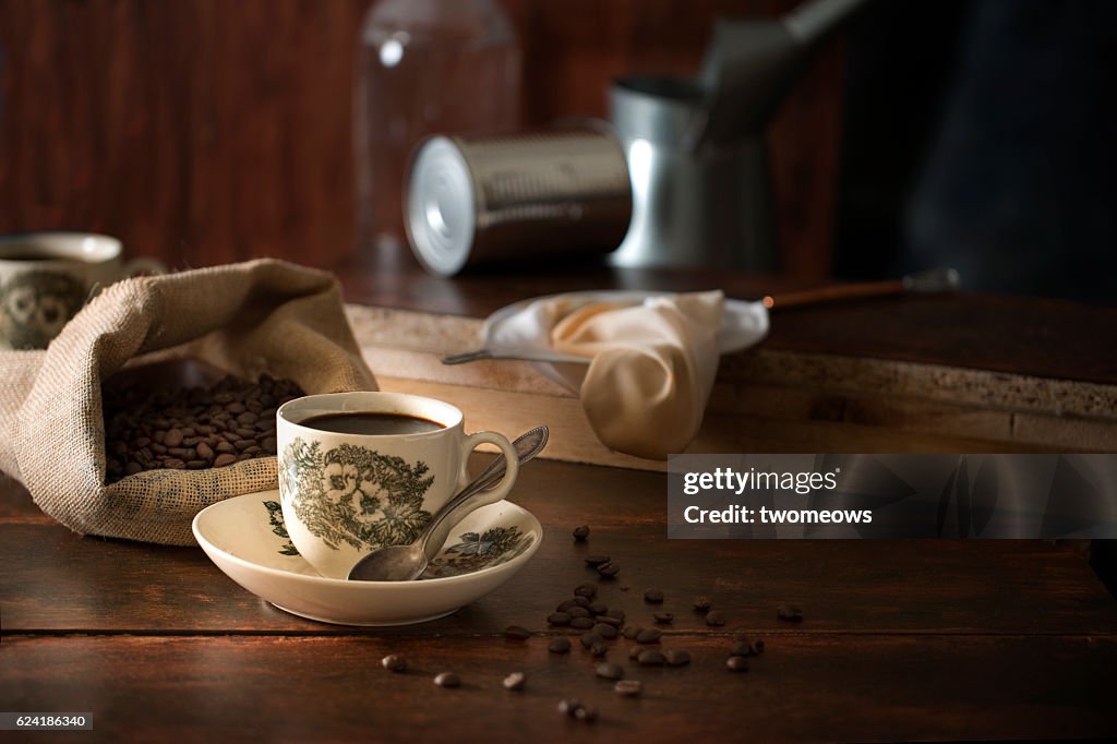 South east asian Malaysian Singaporean local traditional black coffee in vintage cups.