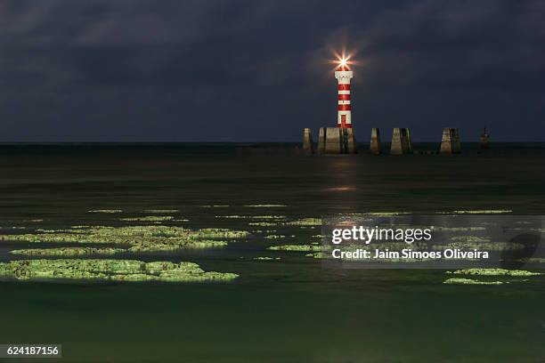 lighthouse of ponta verde beach under moonlight - maceió - alagoas - brazil - thunderstorm ocean blue stock pictures, royalty-free photos & images