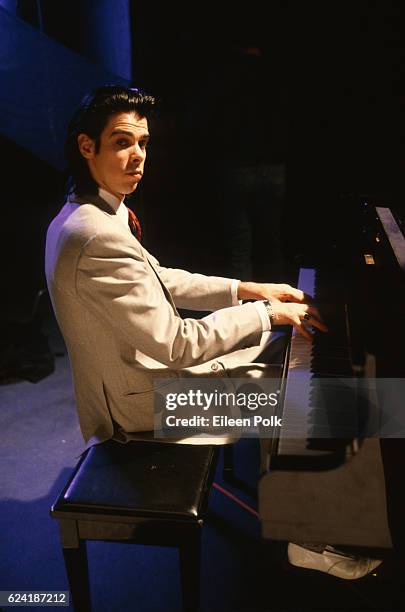 Portrait of Australian musician Nick Cave, of the group Nick Cave and the Bad Seeds, seated at a piano during the filming of the 'Ship Song' music...