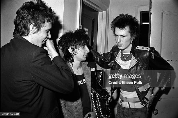 From left, American musicians Richard Hell and Johnny Thunders stand with English musician Sid Vicious backstage at Palladium, New York, New York,...