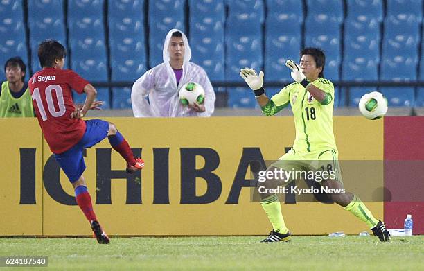 South Korea - South Korea's Ji So Yun scores her second goal past Japan goalkeeper Ayumi Kaihori during the second half of a Women's East Asian Cup...