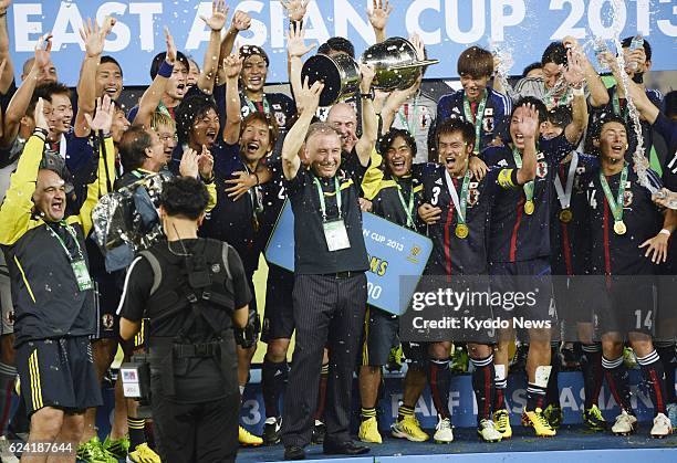 South Korea - Japan coach Alberto Zaccheroni and players celebrate after winning the East Asian Cup title in Seoul on July 28, 2013. Japan defeated...