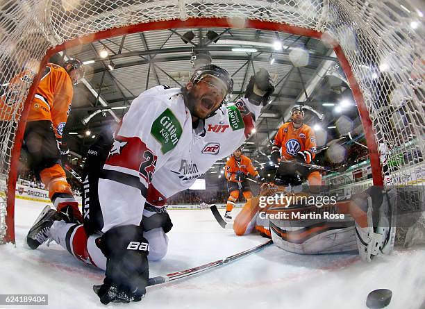 Max Reinhart of Koeln celebrates after scoring the 4th goal during the DEL match between Grizzly Wolfsburg and Koelner Haie at BraWo Ice Arena on...