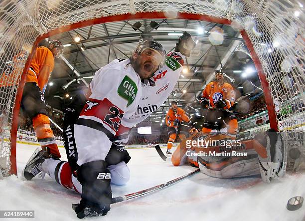 Max Reinhart of Koeln celebrates after scoring the 4th goal during the DEL match between Grizzly Wolfsburg and Koelner Haie at BraWo Ice Arena on...
