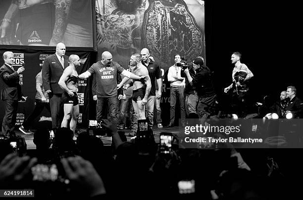 Eddie Alvarez and Conor McGregor during weigh-in at Madison Square Garden. New York, NY CREDIT: Taylor Ballantyne