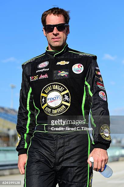 Scott Lagasse Jr, driver of the Alert Tonight FL/Florida Lottery Chevrolet, walks down the grid during qualifying for the NASCAR Camping World Truck...