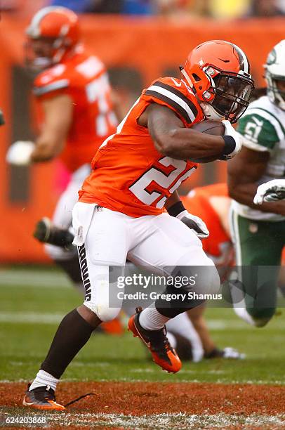 Duke Johnson of the Cleveland Browns carries the ball in front of David Harris of the New York Jets during the second quarter at FirstEnergy Stadium...