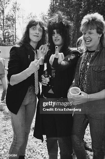 Nikki Sixx of Motley Crue backstage with fans at Monsters Of Rock festival, Donington Park, Leicestershire, United Kingdom, August 18th 1984.