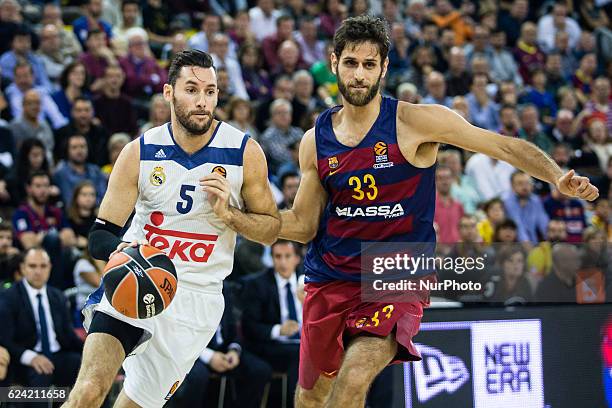 Real Madrid player Rudy Fernandez from Spain defensed by The FC Barcelona player Stratos Perperoglou from Greece in action during the Euroleague...