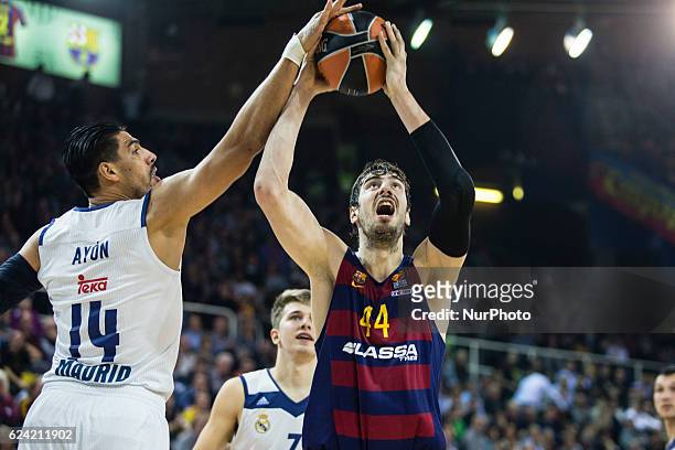 The FC Barcelona player Ante Tomic from Croatia defensed by Real Madrid player Gustavo Ayon from Mexico in action during the Euroleague Turkish...