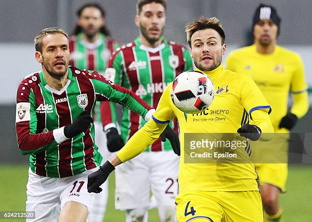 Marko Devic of FC Rubin Kazan vies for the ball with Vladimir Granat FC Rostov Rostov-On-Don during the Russian Premier League match between FC Rubin...
