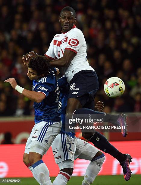 Lille's Ivorian forward Junior Tallo vies with Lyon's Brazilian defender Rafael da Silva during the French L1 football match between Lille and Lyon...