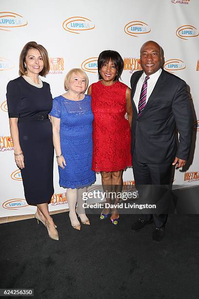 Janice Arouh, Joan Robbins, Caroline Folks, and Byron Allen arrive at the 14th Annual Lupus LA Hollywood Bag Ladies Luncheon at The Beverly Hilton...