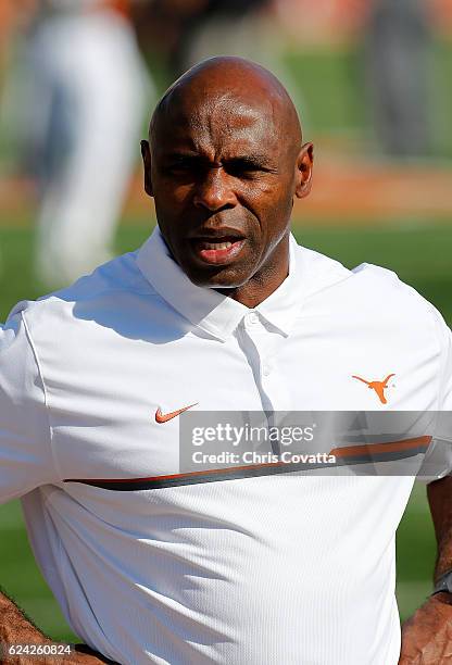 Head coach Charlie Strong of the Texas Longhorns watches as his team warms-up before the game against the West Virginia Mountaineers at Darrell K...