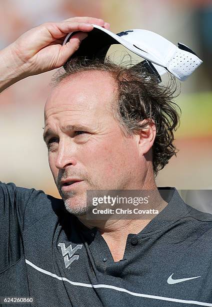 Head coach Dana Holgorsen of the West Virginia Mountaineers watches as his team plays the Texas Longhorns at Darrell K Royal -Texas Memorial Stadium...