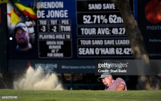 Brendon de Jonge plays a bunker shot on the 18th hole during the second round of The RSM Classic at Sea Island Resort Seaside Course on November 18,...
