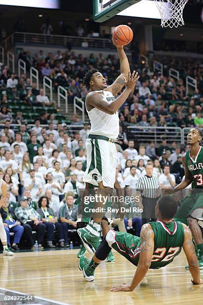 Nick Ward of the Michigan State Spartans shoots over Michael Matlock of the Mississippi Valley State Delta Devils at the Breslin Center on November...