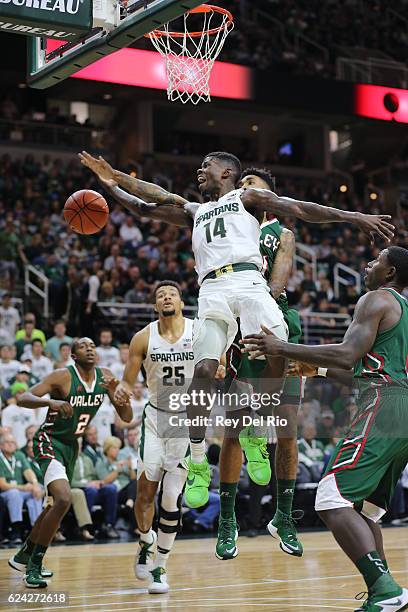 Eron Harris of the Michigan State Spartans drives to the basket and draws a foul from Terence Traylor of the Mississippi Valley State Delta Devils at...
