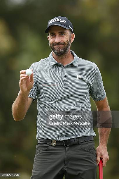 Geoff Ogilvy of Australia acknowledges the crowd after a birdie putt on the 18th green during day three of the Australian golf Open at Royal Sydney...