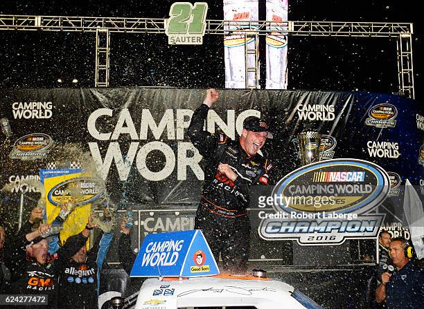Johnny Sauter, driver of the Allegiant Travel Chevrolet, celebrates in Victory Lane after winning the NASCAR Camping World Truck Series Championship...